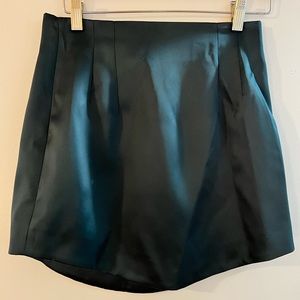 Zara dark green mini skirt with satin finish.